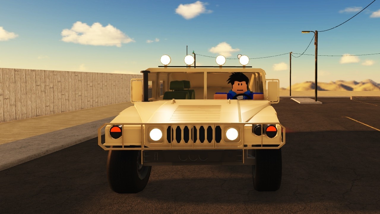 Tan Humvee with roof lights on a desert road in Drive Cars Down A Hill